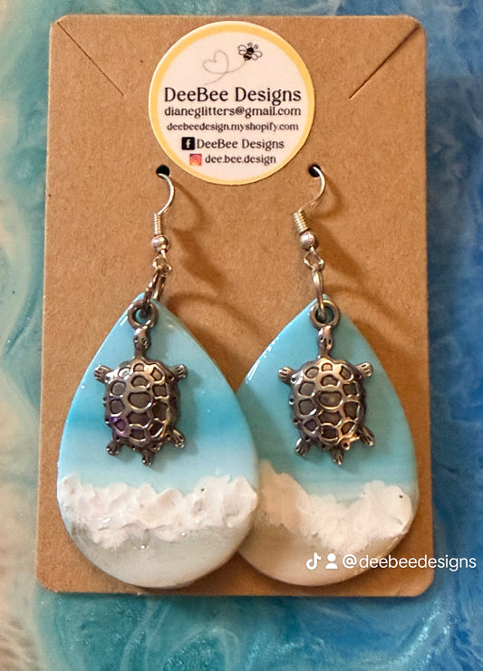Ocean Themed Dangle with silver Tortoise-embellishment on silver plated hypoallergenic fishhook.